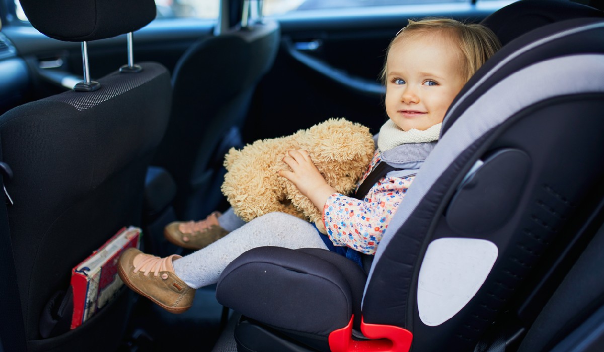 carseat cover mighty-moms Things To Have In Your Car for Your Kids like a carseat cover