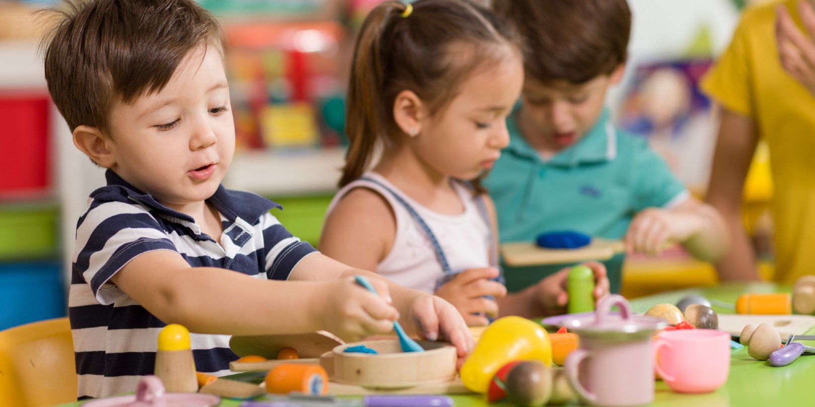 Childs are playing with play clay in classroom