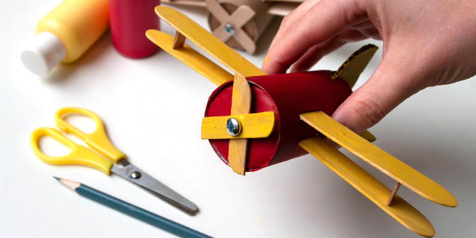How to make airplane. Hand made toy,zero waste from toilet paper roll and popsicle sticks. Modeling. Step 21 put all details of aircraft together. DIY for child, ideas to make during home quarantine.