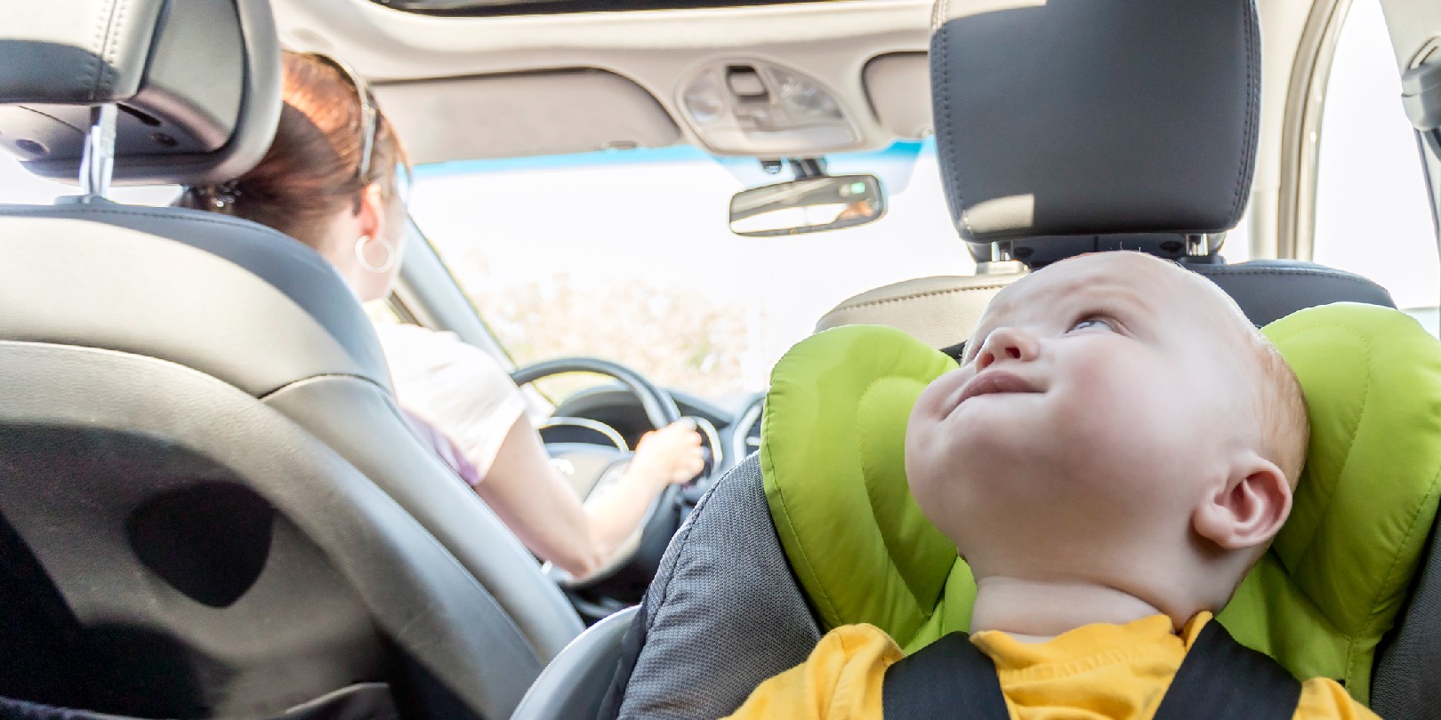 Happy Baby Boy Secure in Baby Car Seat