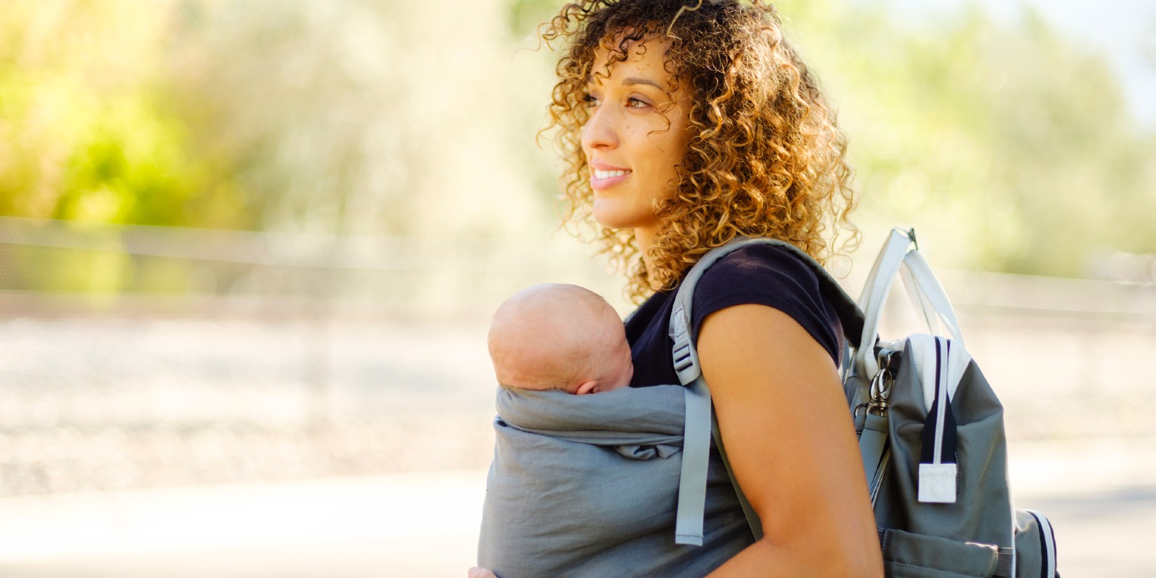 A young mother with her children in the park.