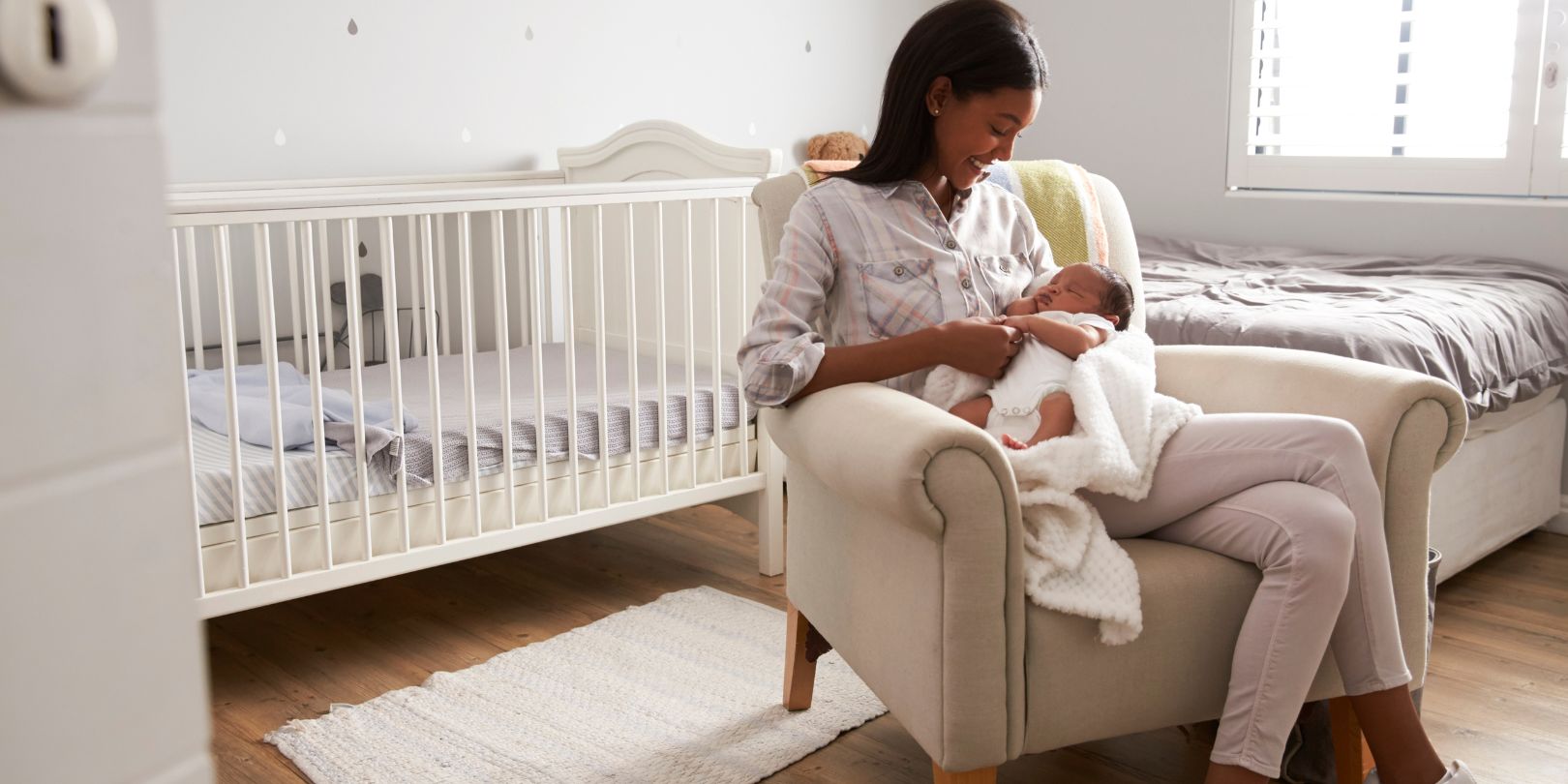 Mother Home from Hospital with Newborn Baby in Nursery