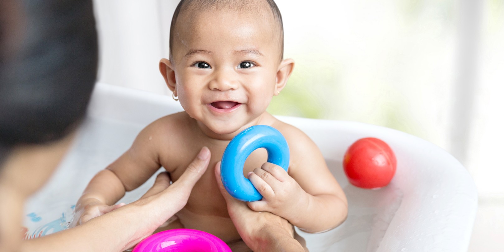 Asian Baby Taking a Bath