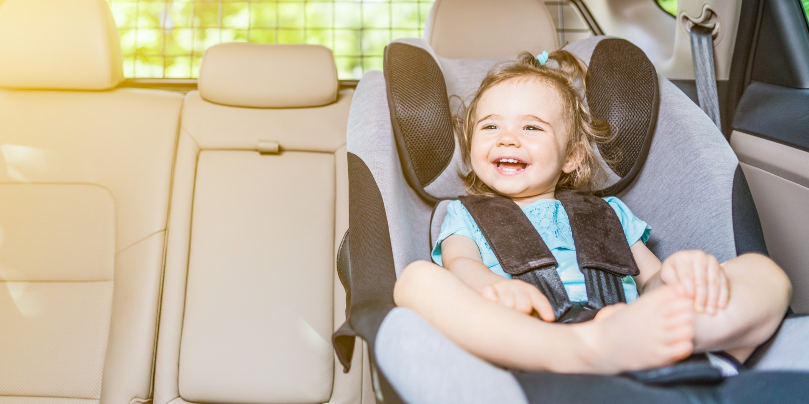 Infant Baby Girl Buckled into Her Car Seat