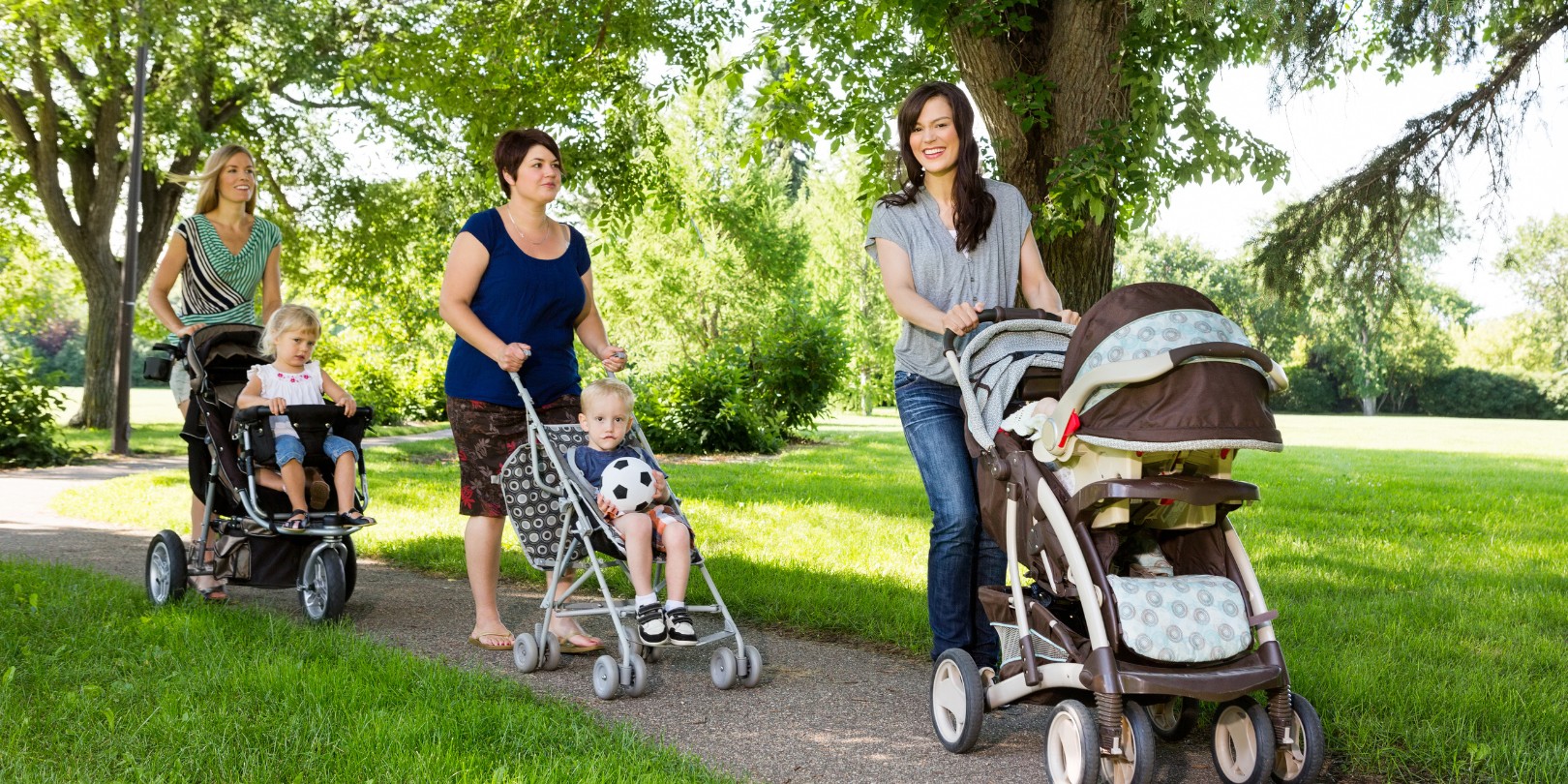 Mothers with Baby Strollers Walking in Park