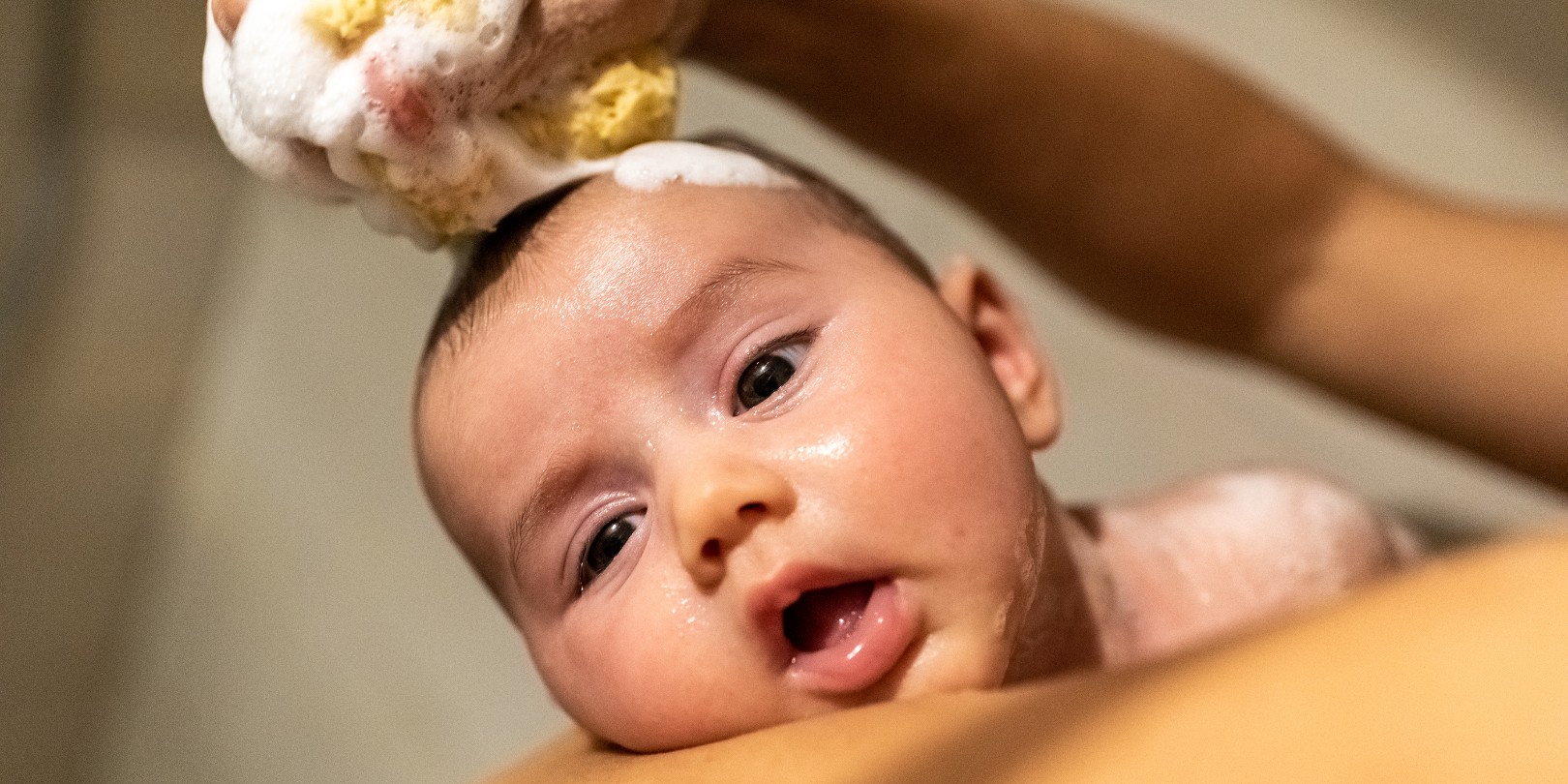 Newborn Baby Having a Bath