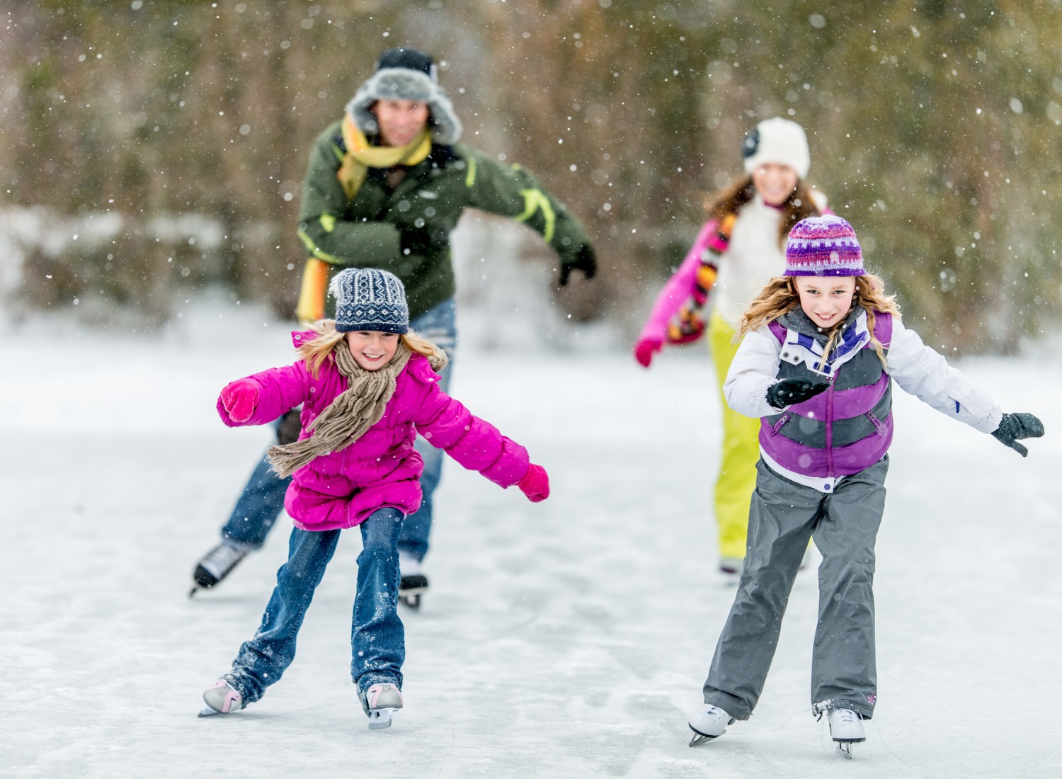 Family ice skating outside