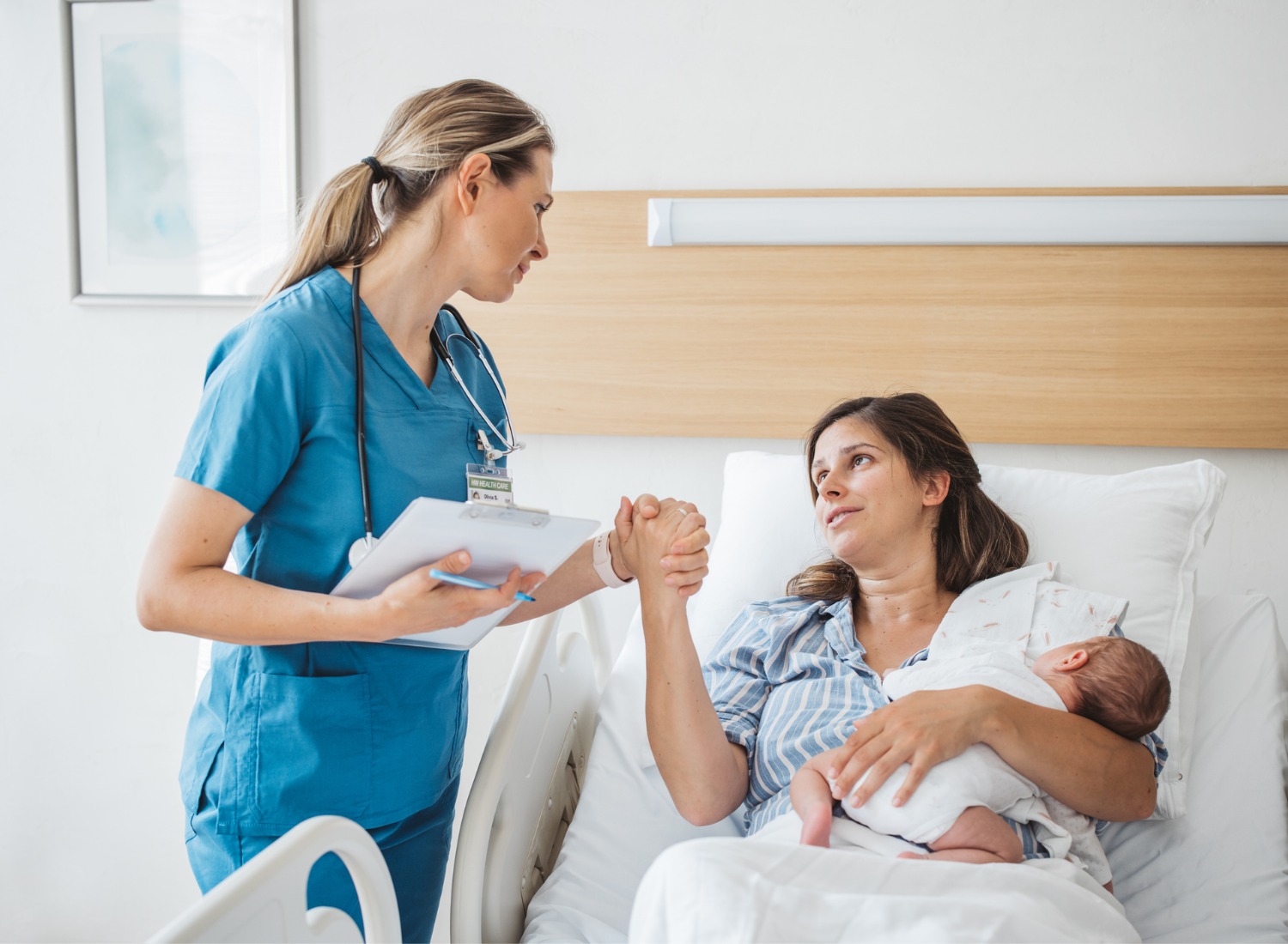 Woman thanking her postpartum nurse