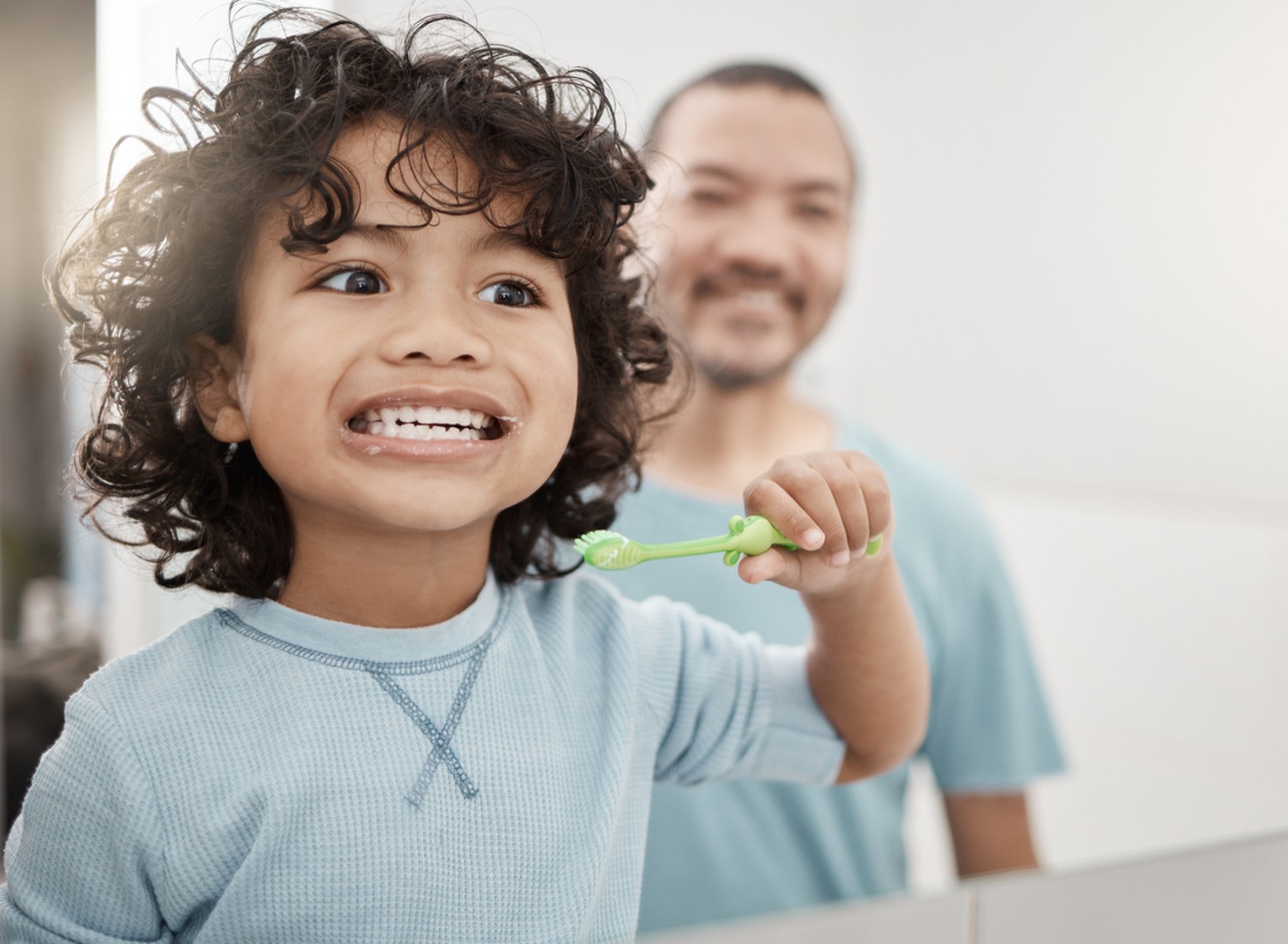 Toddler brushing his teeth